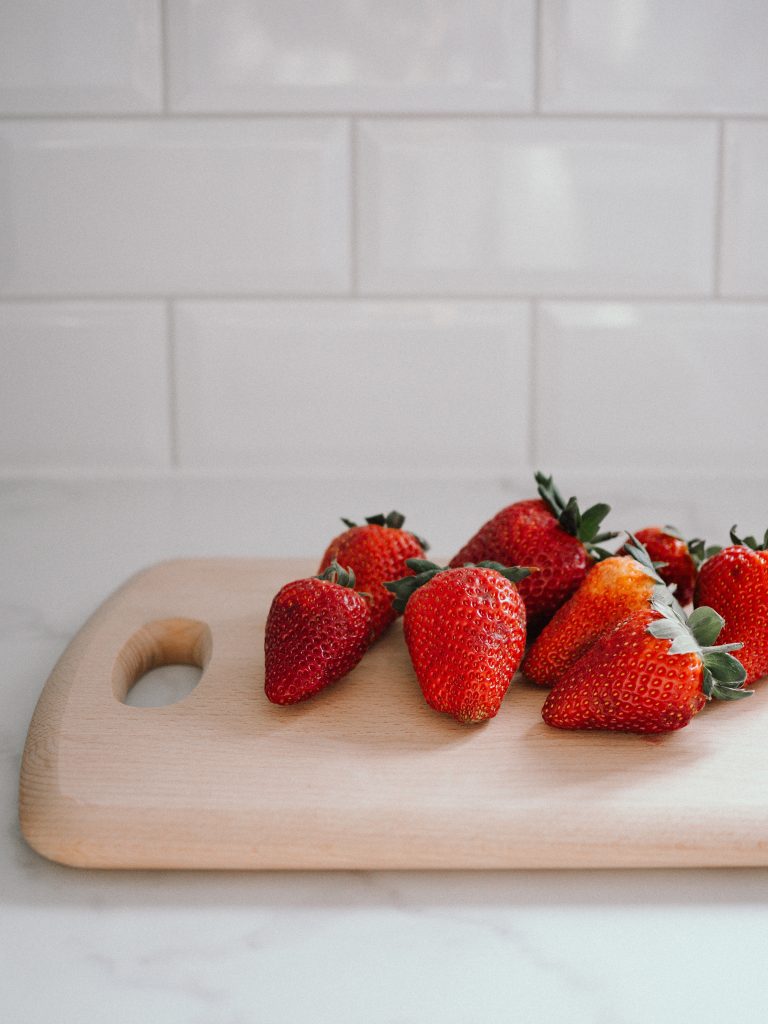 hydrating strawberries on a cutting board