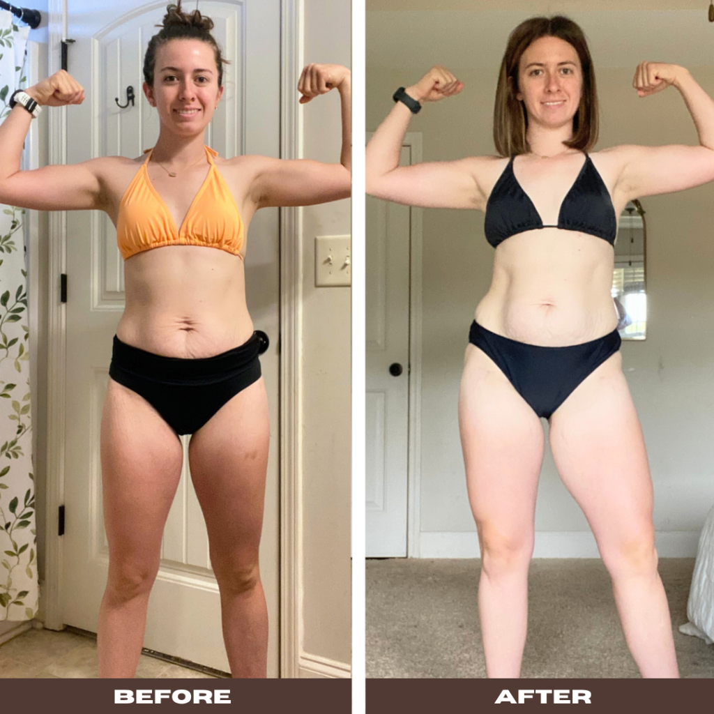 A woman stands confidently in a bathroom, smiling and flexing both arms in a strong pose. She wears a yellow bikini top and black high-waisted bottoms. Her body shows visible muscle tone in her arms and legs, and her midsection reveals healed skin and improved core integrity postpartum. The background features a white door and a leafy shower curtain.